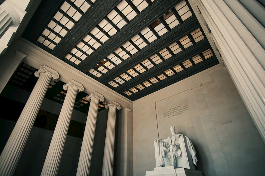 a grand view of the Lincoln memorial statue, surrounded by columns