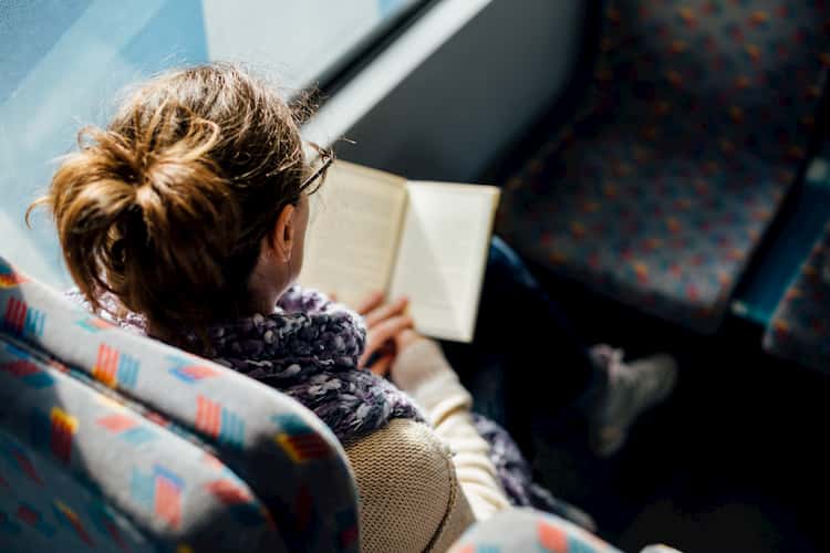 Woman reading in bus