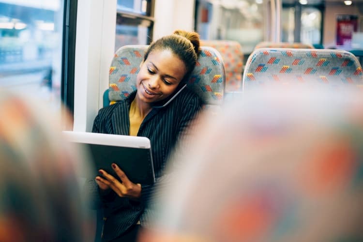 Businesswoman working on bus
