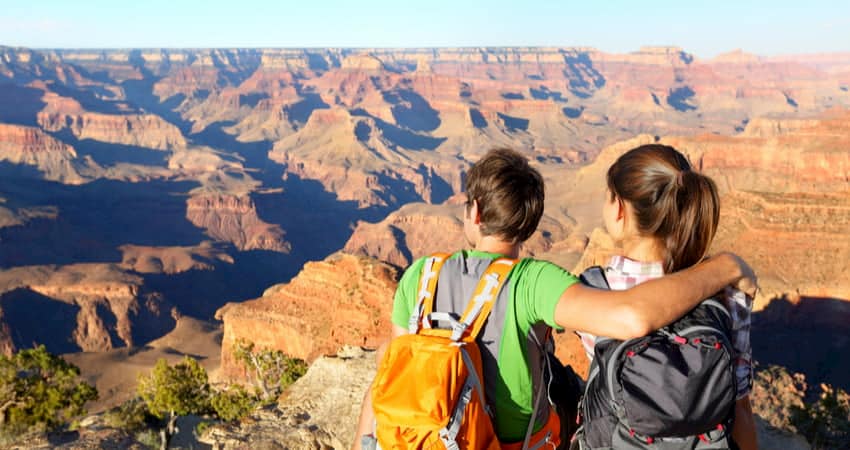 Couple sitting together at Grand Canyon