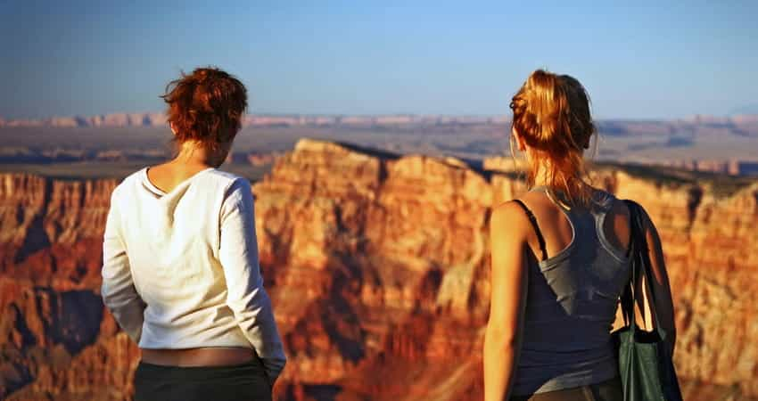 two women looking over a canyon after a hike