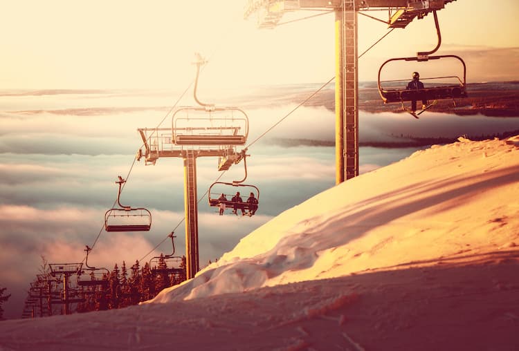 Ski slopes and ski lift at sunset