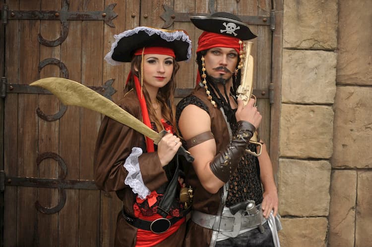 two people dressed in pirate costumes