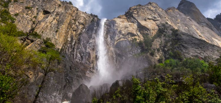 a view of bridalveil fall with mist at the base of the falls