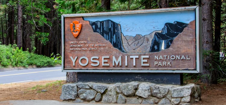 an entry sign for yosemite national park