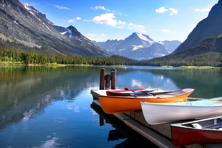 Canoes by lake in Glacier National Park