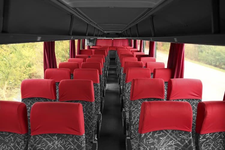 Charter bus with gray and red seats