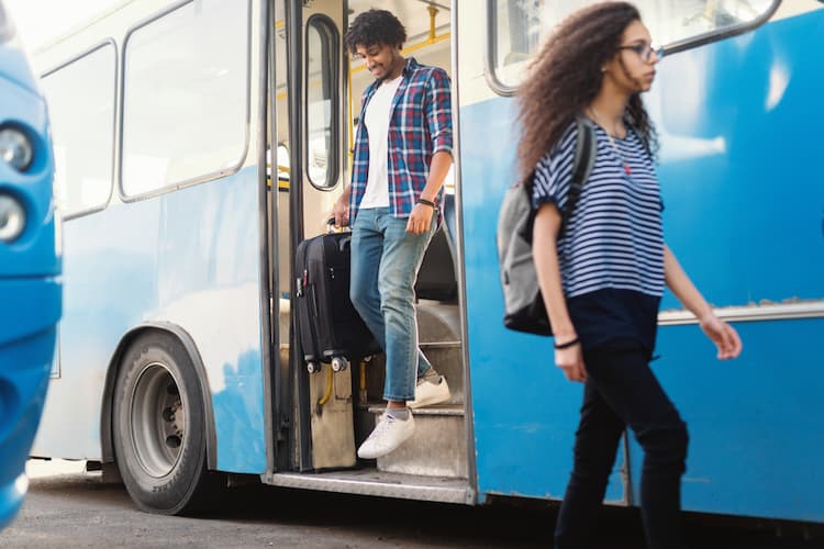 People climbing off bus