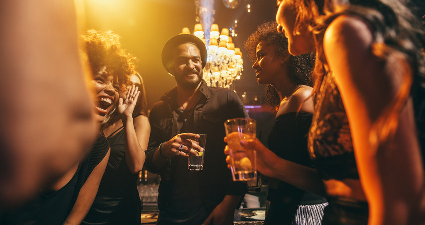 A group of friends having drinks at a bar