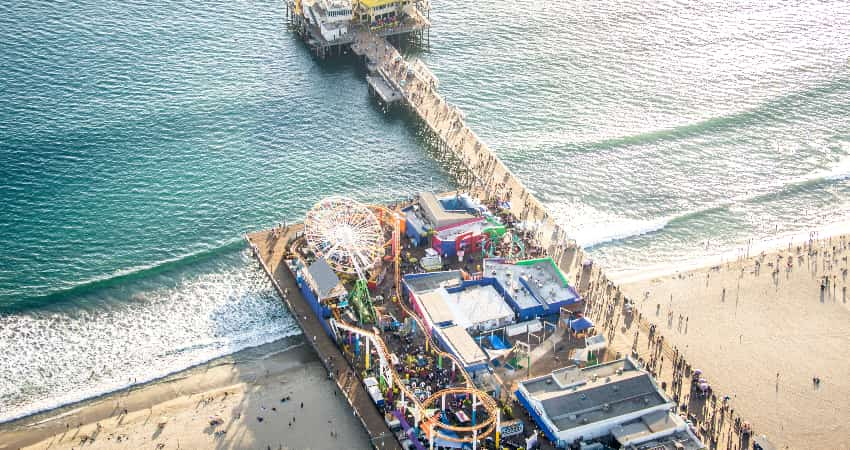 Areial view of the Santa Monica Pier and Boardwalk full of people