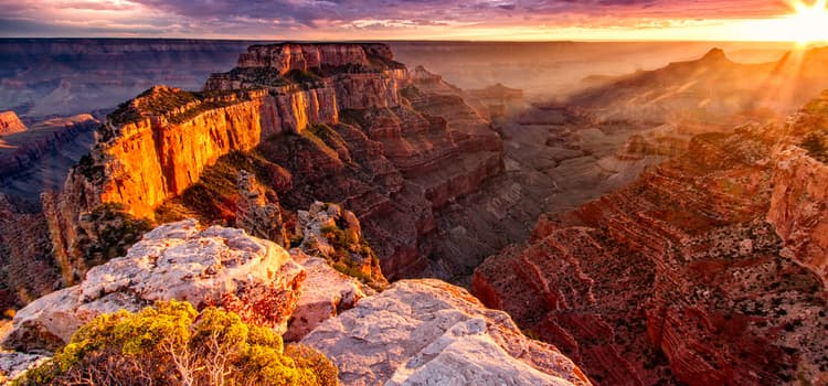 a view of the complex crevasses and rocky hills at sunset