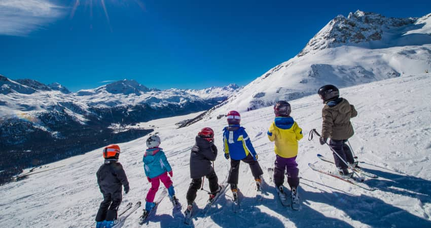 A group of children skiing