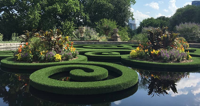 A relfection pool surrounded by greenery at the Atlanta Botanical Gardens