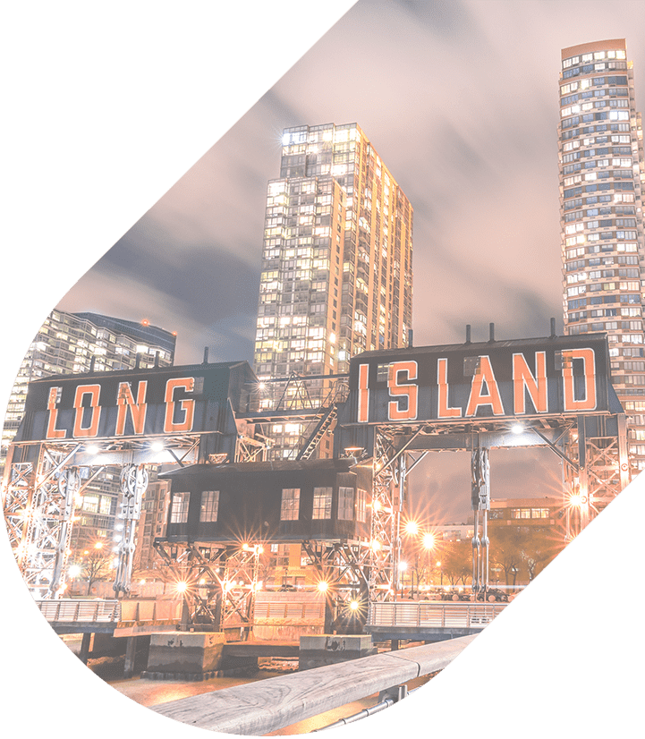 a "long island" sign lit up with bright lights and surrounded by twinkling city lights