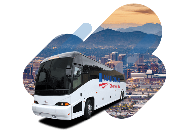 a white charter bus with the "national charter bus" logo over a graphic of the Phoenix skyline 