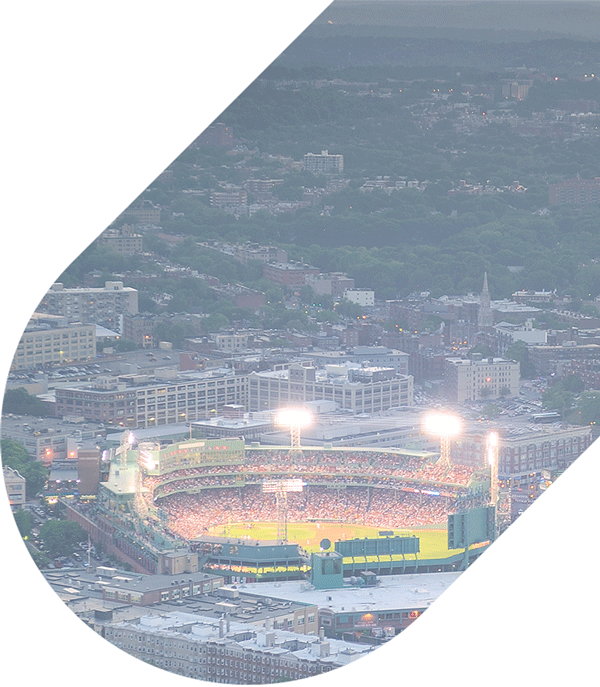 an aerial view of fenway park at night with bright lights