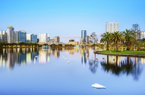 a view of the orlando skyline over lake eola park