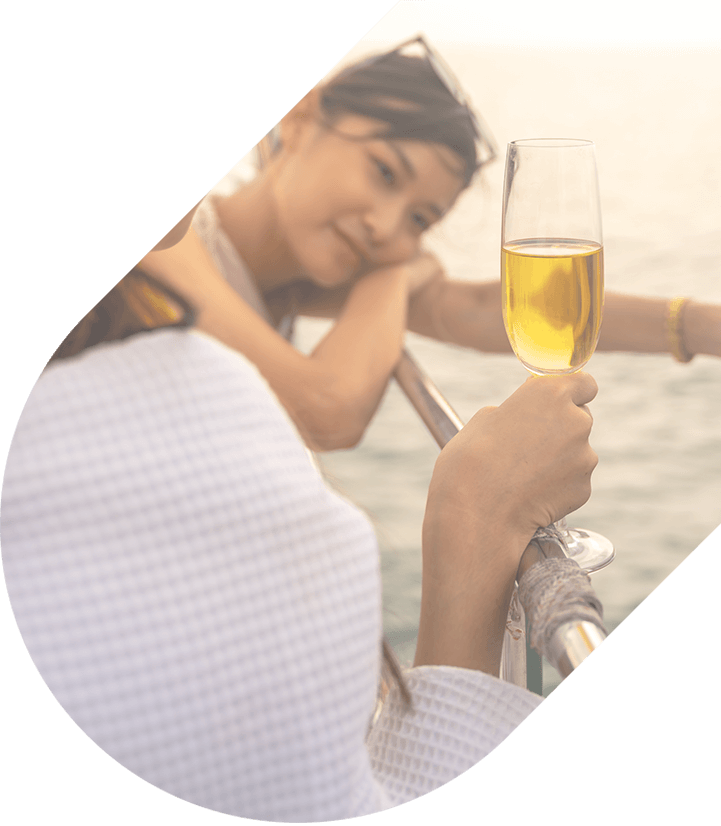 Two women toasting champagne on a cruise ship 