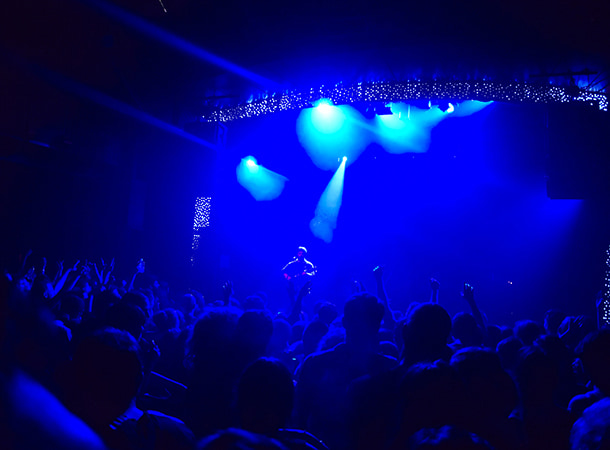 Dim lights over a concert crowd