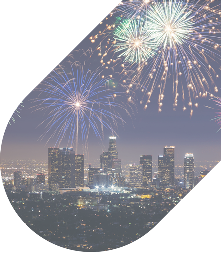 Fireworks exploding over the Los Angeles city skyline at night
