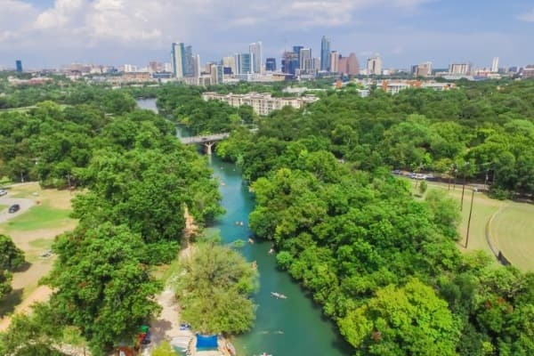 An aerial view of the lush green trees at Zilker Metropolitan Park