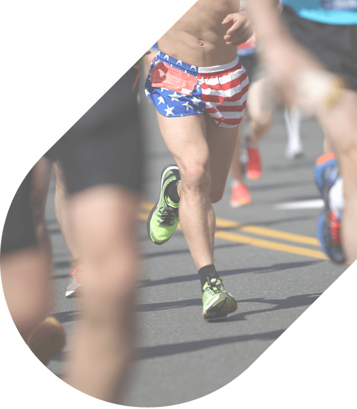 Closeup of legs of runners during the Boston Marathon
