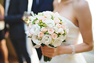 A bride holds a bouquet on her wedding day