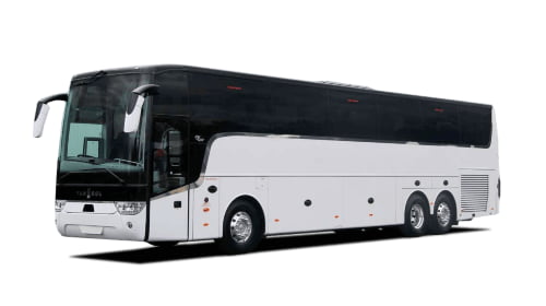 an all-white van hool charter bus