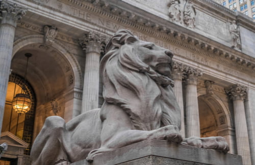 lion statue in front of the new york public library