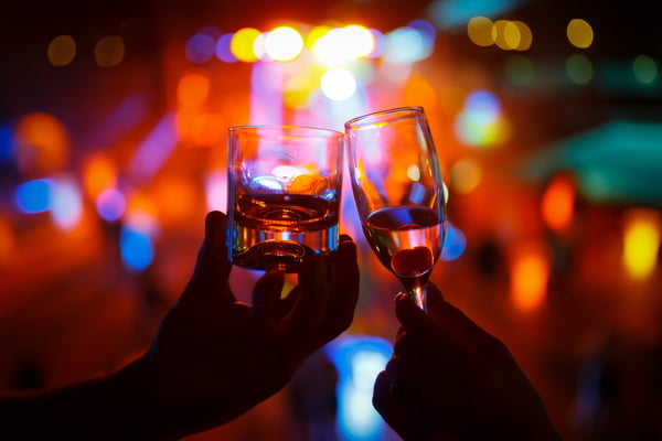 Drinks clinking at a nightclub or bar in washington dc