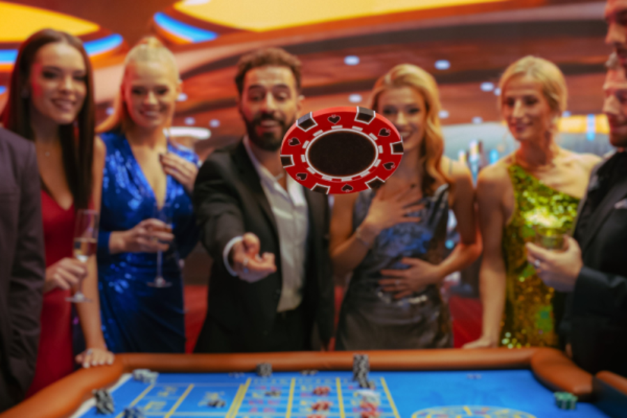casino-goers throw a chip onto a game table