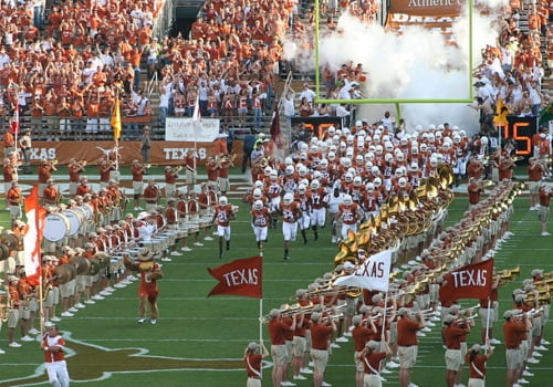 Texas Longhorns football team entering stadium